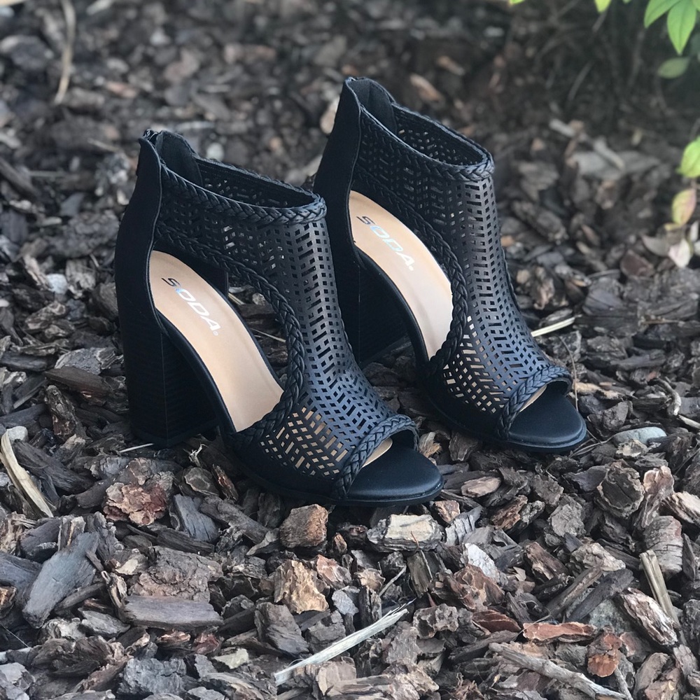 Black laser cutout booties w braided detail